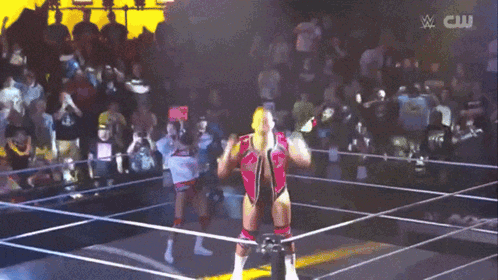 Man In Wrestling Ring With CW Logo GIF
