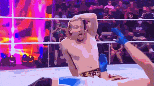 Man in Wrestling Ring With Hash on Shirt