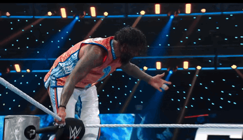 Man In Wrestling Ring With Letter W On Ropes GIF