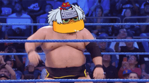 Man In Wrestling Ring With Ninja On Head GIF