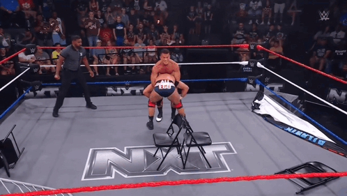 Man In Wrestling Ring With NXT GIF