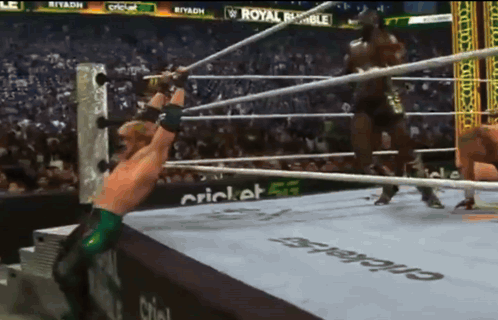Man in Wrestling Ring With Royal Rumble Ad