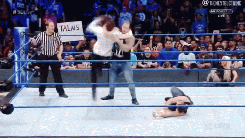Man In Wrestling Ring With Talms Sign GIF