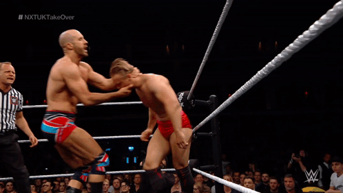 Man in Wrestling Ring With W Logo