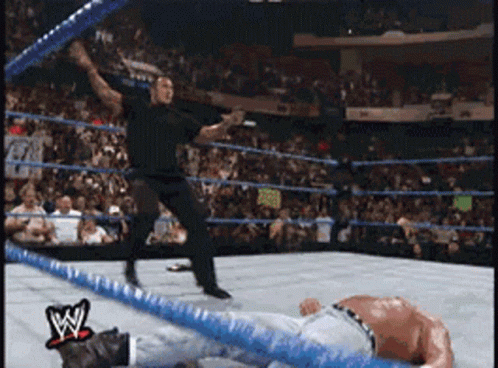 Man In Wrestling Ring With W Logo GIF