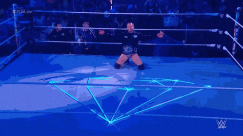 Man in Wrestling Ring with W Logo