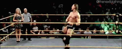 Man In Wrestling Ring With Woman Behind Nextbigthing GIF
