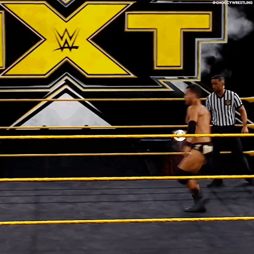 Man in Wrestling Ring With X on Back