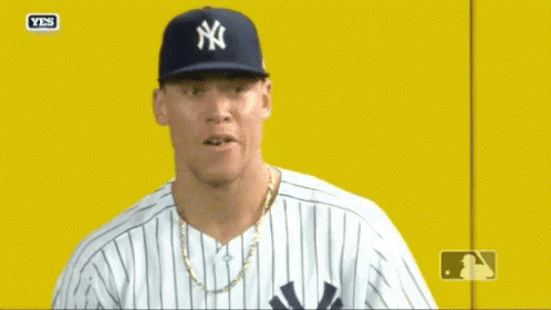 Man in Yankees Hat and Striped Shirt