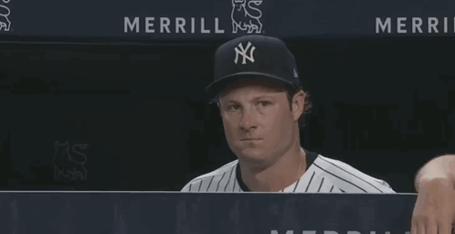 Man in Yankees Hat Looking at Camera