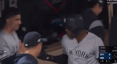 Man In Yankees Jersey Talking To Another Man GIF