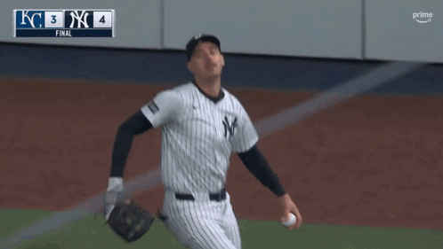 Man in Yankees Uniform Throwing Ball