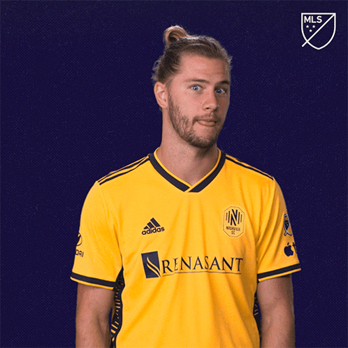 Man in Yellow Adidas Shirt Thumbs Up