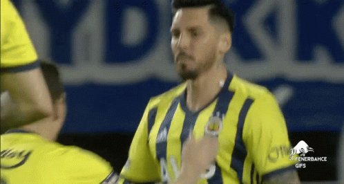 Man in Yellow and Blue Striped Fenerbahce Jersey