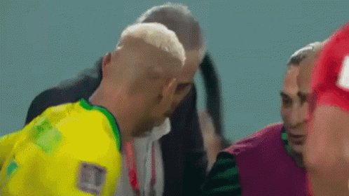Man in Yellow and Green Jersey Talking