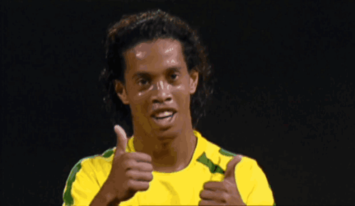Man in Yellow and Green Shirt Looking Down