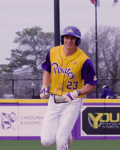 Man in Yellow and Purple Pirates Jersey