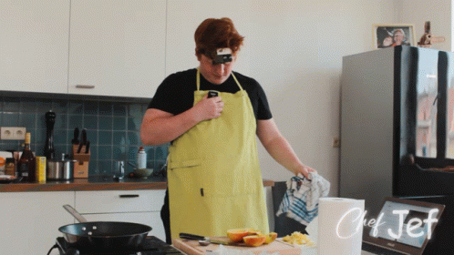 Man in Yellow Apron Cooking in Kitchen Chef Jef