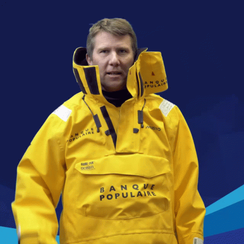 Man in Yellow Banque Populaire Jacket Blue Background