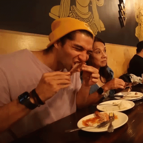 Man In Yellow Beanie Eating Food GIF