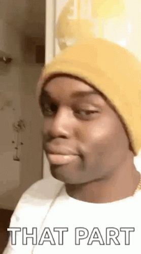 Man in Yellow Beanie Making Funny Face