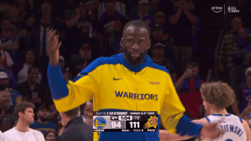 Man in Yellow Blue Warriors Jacket