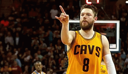 Man In Yellow Cavs Jersey Pointing Up GIF