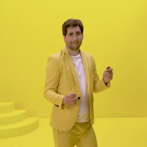 Man In Yellow Coin Flip GIF