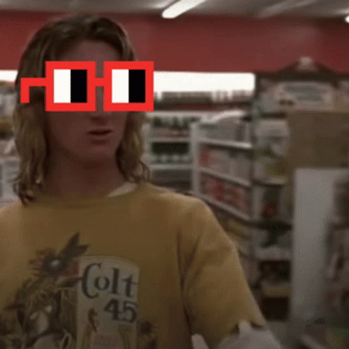 Man in Yellow Colt 45 Shirt Pointing