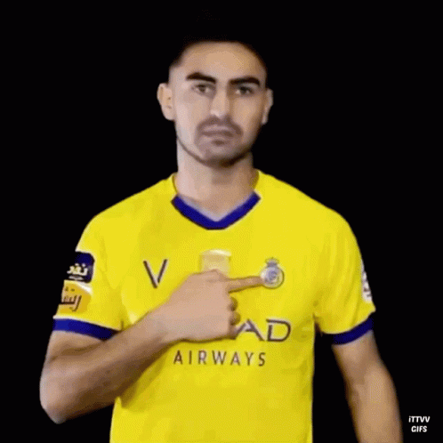 Man In Yellow Etihad Airways Jersey Waving GIF