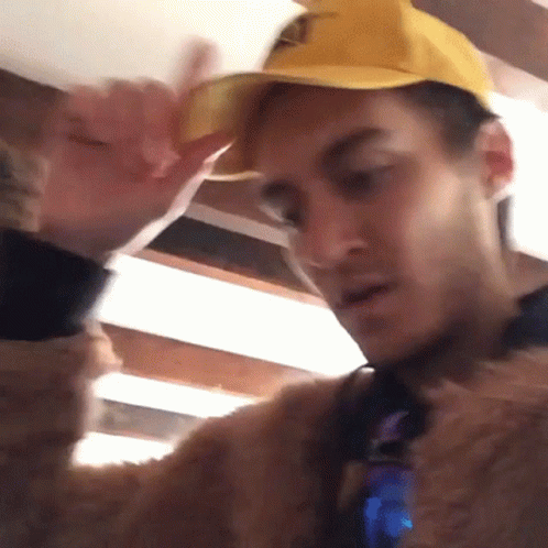 Man in Yellow Hat and Fur Coat
