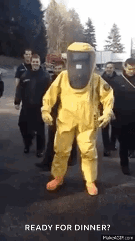 Man in Yellow Hazmat Suit Walking