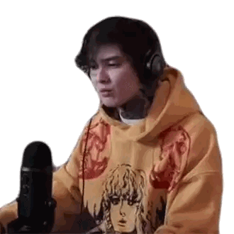 Man in Yellow Hoodie at Microphone