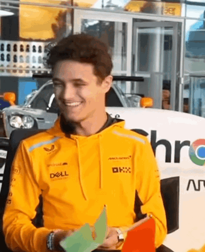 Man In Yellow Hoodie Holding Paper GIF