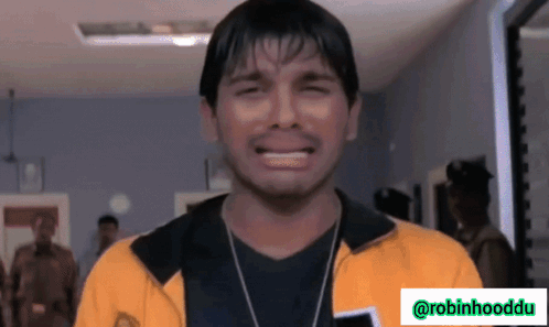 Man In Yellow Jacket Crying With Robinhooddu Logo GIF