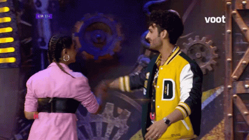 Man in Yellow Jacket D and Woman in Pink