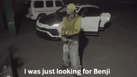 Man in Yellow Jacket in Front of White Car Says I Was Just Looking for Benji