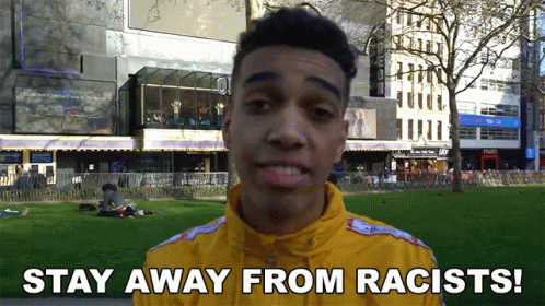 Man In Yellow Jacket Says Stay Away From Racists GIF