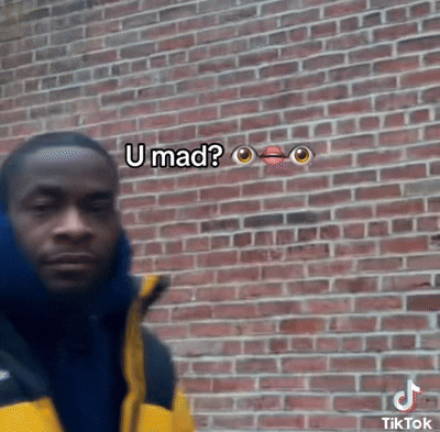 Man in Yellow Jacket Says U Mad