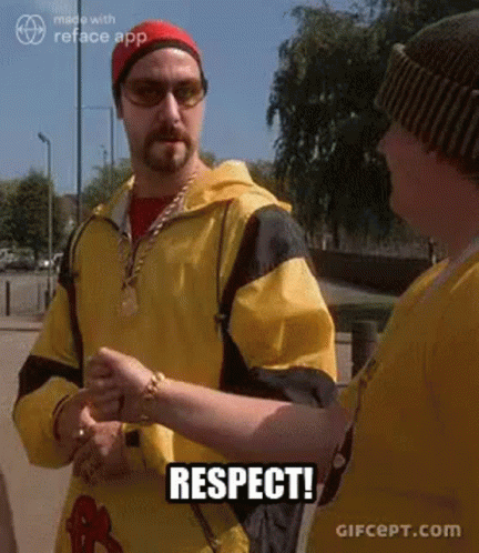 Man in Yellow Jacket Shaking Hands