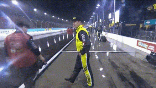 Man in Yellow Jacket With Shell on Pants