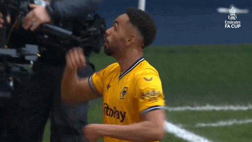 Man in Yellow Jersey Celebrating