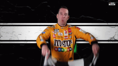 Man in Yellow M&M's Shirt Holding Flag