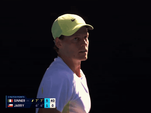 Man In Yellow Nike Hat Looking At Scoreboard GIF
