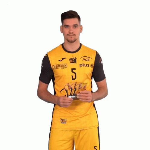 Man in Yellow PGE Jersey Holding Cards