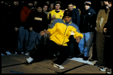 Man In Yellow Puma Shirt Facing Crowd GIF