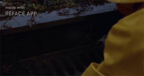 Man in Yellow Raincoat Peeking from Manhole