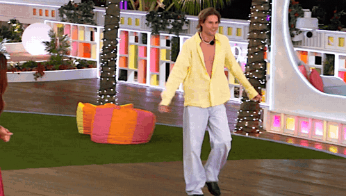 Man In Yellow Shirt And White Pants Dancing GIF