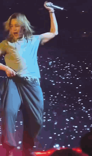 Man In Yellow Shirt Dancing On Stage GIF