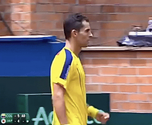 Man in Yellow Shirt Facing Col 5 Ad